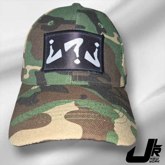 A camouflage patterned baseball cap with a black JLR Classic patch on the front.